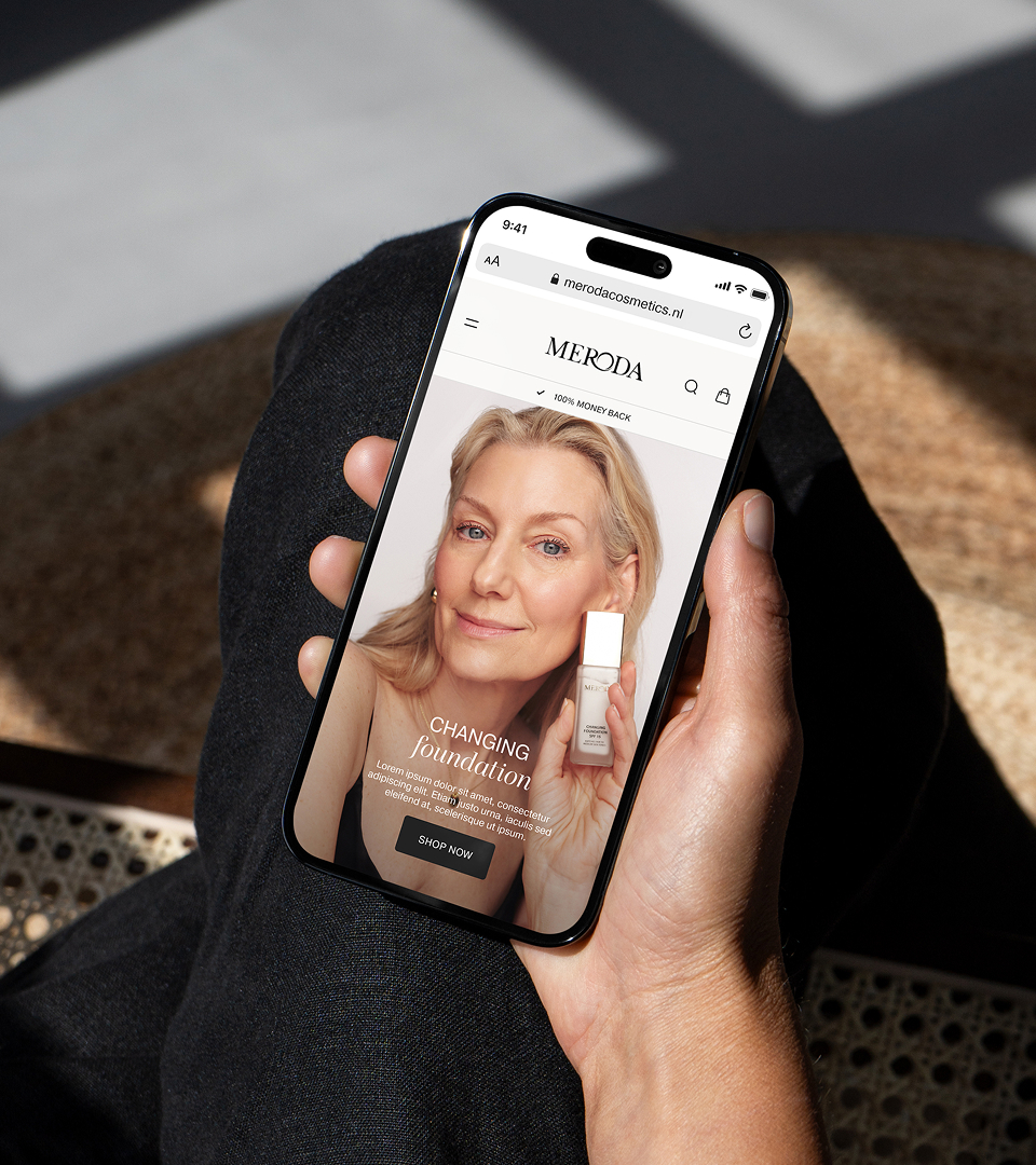 Meroda Cosmetics mobile website displayed on smartphone showing product page and editorial imagery